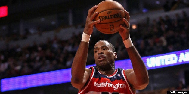 CHICAGO, IL - APRIL 17: Jason Collins #98 of the Washington Wizards rebounds against the Chicago Bulls at the United Center on April 17, 2013 in Chicago, Illinois. The Bulls defeated the Wizards 95-92. NOTE TO USER: User expressly acknowledges and agrees that, by downloading and or using this photograph, User is consenting to the terms and conditions of the Getty Images License Agreement. (Photo by Jonathan Daniel/Getty Images)