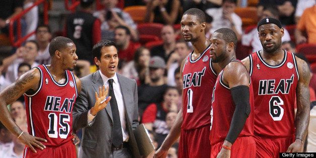 Miami Heat head coach Erik Spoelstra, gives instructions to Mario Chalmers,(15), Chris Bosh,(1), Dwyane Wade,(3), and LeBron James,(6) during overtime against the Sacramento Kings at the American Airlines Arena in Miami, Florida, Tuesday, February 26, 2013. The Heat defeated the Kings in double overtime, 141-129. (David Santiago/El Nuevo Herald/MCT via Getty Images)