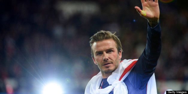 Paris Saint-Germain's English midfielder David Beckham waves after the French L1 football match between Paris St Germain and Brest on May 18, 2013 at Parc des Princes stadium in Paris. AFP PHOTO / FRED DUFOUR (Photo credit should read FRED DUFOUR/AFP/Getty Images)