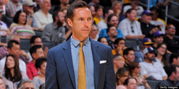 LOS ANGELES, CA - APRIL 28: Steve Nash #10 of the Los Angeles Lakers, wearing street clothes, looks on from the sideline as h