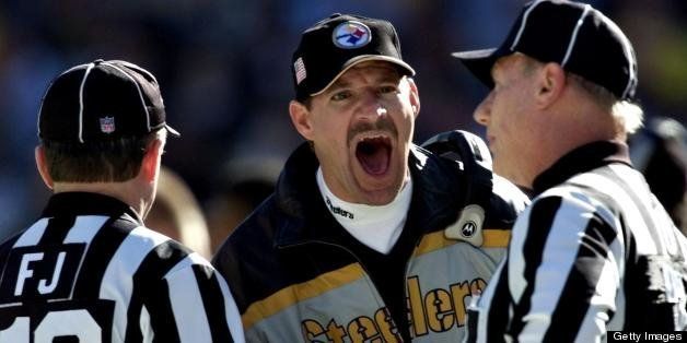 PITTSBURGH, UNITED STATES: Pittsburgh Steelers head coach Bill Cowher (C) screams at two officials after a penalty against the Steelers caused a re-kick of a punt and a New England patriots punt return for a touchdown during the first quarter of the AFC Championship game 27 January, 2002 at Heinz Stadium in Pittsburgh, PA. The winner will face either the St. Louis Rams or the Philadelphia Eagles in the Super Bowl. AFP PHOTO/Don EMMERT (Photo credit should read DON EMMERT/AFP/Getty Images)
