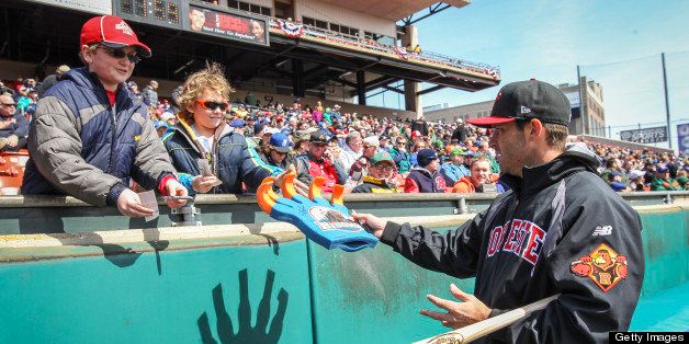 BUFFALO, NY - APRIL 4: Rochester Red Wings Drew Butera (22) signs autographs for young fans during opening day for the Blue Jays new AAA farm team the Buffalo Bisons who defeated the Rochester Red Wings 12-7 at Coca-Cola Field. (David Cooper/Toronto Star via Getty Images)