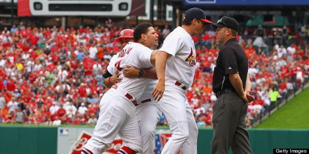ST. LOUIS, MO - JUNE 2: Yadier Molina #4 and manager Mike Matheny #22 both of the St. Louis Cardinals argue with umpire Clint Fagan #82 after Molina was ejected from the game by Fagen in a game against the San Francisco Giants in the third inning at Busch Stadium on June 2, 2013 in St. Louis, Missouri. (Photo by Dilip Vishwanat/Getty Images)