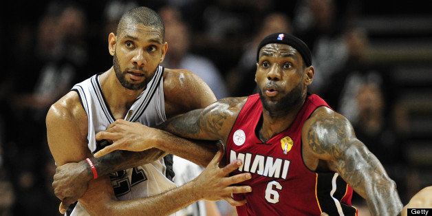 Tim Duncan (L) and Gary Neal (R) of the San Antonio Spurs play tight defense on LeBron James of the Miami Heat during game 3 of the NBA finals against the Miami Heat on June 11, 2013 in San Antonio, Texas. The Spurs defeated the Heat 113-77 to take a 2-1 lead in the best-of-seven championship series. AFP PHOTO/Frederic J. BROWN (Photo credit should read FREDERIC J. BROWN/AFP/Getty Images)