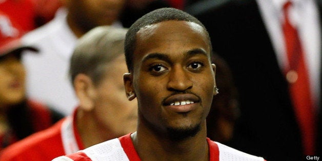 ATLANTA, GA - APRIL 06: Injured Louisville Cardinals player Kevin Ware #5 cheers on his team from the bench before the Cardinals take on the Wichita State Shockers in the 2013 NCAA Men's Final Four Semifinal at the Georgia Dome on April 6, 2013 in Atlanta, Georgia. (Photo by Kevin C. Cox/Getty Images)