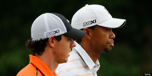 ARDMORE, PA - JUNE 14: (L-R) Rory McIlroy of Northern Ireland and Tiger Woods of the United States walk up the tenth hole du