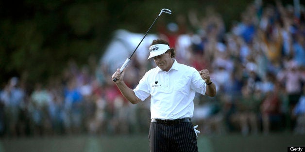 Phil Mickelson of United States reacts to his biddy putt on the 18th green finishing his second round of the US Open at Merio