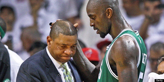 MIAMI, FL - JUNE 9: Celtics head coach Doc Rivers, left, and Kevin Garnett, right, share a moment on the sidelines after Garnett left the game as the clock was winding down in the game. The Boston Celtics visited the Miami Heat for game seven of the NBA Eastern Conference Finals at the American Airlines Arena. (Photo by Jim Davis/The Boston Globe via Getty Images)