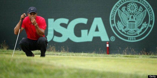 ARDMORE, PA - JUNE 16: Tiger Woods of the United States lines up a putt on the second hole during the final round of the 113