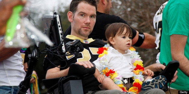 NEW ORLEANS, LA - FEBRUARY 10: Former NFL New Orleans Saints Safety, Steve Gleason with friends that started Team Gleason to generate public awareness and raise funds for Amyotrophic Lateral Sclerosis rides in the 2013 Krewe of Bacchus Mardi Gras Parade on February 10, 2013 in New Orleans, Louisiana. (Photo by Skip Bolen/Getty Images)