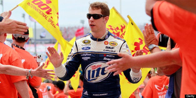 DOVER, DE - JUNE 02: Brad Keselowski, driver of the #2 Miller Lite Ford, takes part in pre-race ceremonies for the NASCAR Sprint Cup Series FedEx 400 benefiting Autism Speaks at Dover International Speedway on June 2, 2013 in Dover, Delaware. (Photo by Geoff Burke/Getty Images)