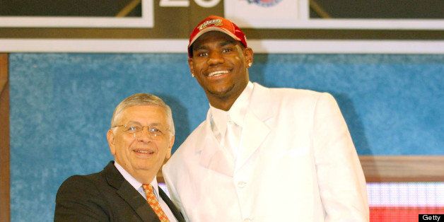 NEW YORK - JUNE 26: LeBron James who was selected number one overall in the first round by the Cleveland Cavailiers shakes hands with NBA Commissioner David Stern during the 2003 NBA Draft at the Paramount Theatre at Madison Square Garden on June 26, 2003 in New York, New York. NOTE TO USER: User expressly acknowledges and agrees that, by downloading and/or using this Photograph, User is consenting to the terms and conditions of the Getty Images License Agreement. (Photo by Jesse D. Garrabrant/NBAE via Getty Images)
