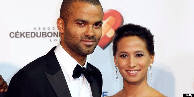 (LtoR) French NBA and international basketball player Tony Parker and his girlfriend Axelle pose during the first edition of 'Monaco Par Coeur', on September 22, 2012 in Monaco. AFP PHOTO / VALERY HACHE (Photo credit should read VALERY HACHE/AFP/GettyImages)