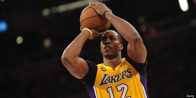 LOS ANGELES, CA - APRIL 26: Dwight Howard #12 of the Los Angeles Lakers shoots a free throw against the San Antonio Spurs at Staples Center in Game Three of the Western Conference Quarterfinals during the 2013 NBA Playoffs on April 26, 2013 in Los Angeles, California. NOTE TO USER: User expressly acknowledges and agrees that, by downloading and/or using this Photograph, user is consenting to the terms and conditions of the Getty Images License Agreement. Mandatory Copyright Notice: Copyright 2013 NBAE (Photo by Noah Graham/NBAE via Getty Images)