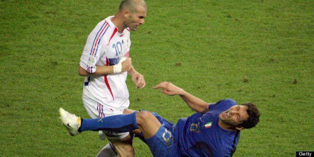 Berlin, GERMANY: A photo taken 09 July 2006 shows French midfielder Zinedine Zidane (L) gesturing after head-butting Italian defender Marco Materazzi during the World Cup 2006 final football match between Italy and France at Berlin?s Olympic Stadium. AFP PHOTO JOHN MACDOUGALL (Photo credit should read JOHN MACDOUGALL/AFP/Getty Images)