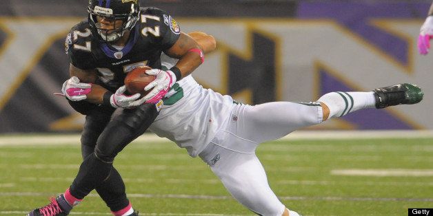 Baltimore Ravens running back Ray Rice takes a short pass that results in big yardage while being defended by New York Jets free safety Eric Smith during the first half of their game on Sunday, October 2, 2011, in Baltimore, Maryland. (Doug Kapustin/MCT via Getty Images)