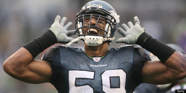 SEATTLE - DECEMBER 23: Line backer Julian Peterson #59 of the Seattle Seahawks urges the crowd to make noise against the Baltimore Ravens at Qwest Field on December 23, 2007 in Seattle, Washington. The Seahawks defeated the Ravens 27-6. (Photo by Otto Greule Jr/Getty Images)