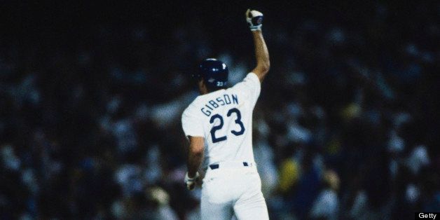 LOS ANGELES, CA - OCTOBER 15: Los Angeles Dodgers' Kirk Gibson #23 gestures to the crowd after hitting a home run during the World Series against the Oakland Athletics at Dodger Stadium on October 15, 1988 in Los Angeles, California. The Dodgers defeated the Athletics 5-4 in game 1 of the series. (Photo by Focus on Sport/Getty Images)