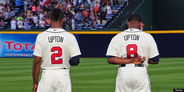 ATLANTA, GA - JUNE 16: B. J. Upton #2 and his brother Justin Upton #8 of the Atlanta Braves stand at attention for the national anthem before the game against the San Francisco Giants at Turner Field on June 16, 2013 in Atlanta, Georgia. (Photo by Scott Cunningham/Getty Images)