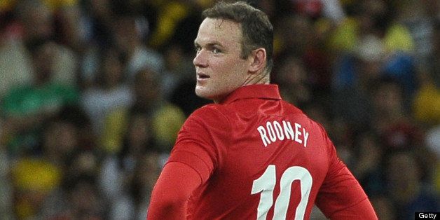 Wayne Rooney of England smiles after scoring against Brazil during their friendly match at the newly-renovated Mario Filho 'Maracana' stadium, in Rio de Janeiro, Brazil, on June 2, 2013. The match ended in a 2-2 draw. AFP PHOTO/Yasuyoshi CHIBA (Photo credit should read YASUYOSHI CHIBA/AFP/Getty Images)