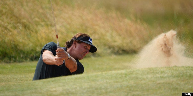 GULLANE, SCOTLAND - JULY 18: Phil Mickelson of the United States hits out of a bunker on the 13th hole during the first roun