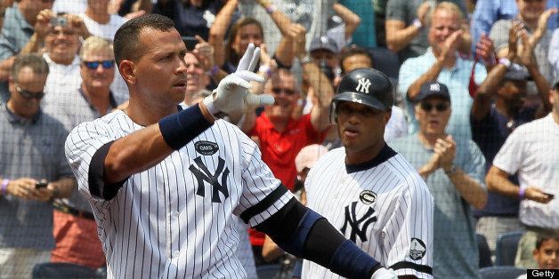NEW YORK - AUGUST 04: Alex Rodriguez #13 of the New York Yankees salutes the crowd after hitting his 600th career home run in the first inning against the Toronto Blue Jays as teammate Robinson Cano #24 looks on on August 4, 2010 at Yankee Stadium in the Bronx borough of New York City. (Photo by Jim McIsaac/Getty Images)