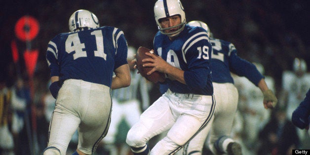 BALTIMORE, MD - DECEMBER 11: Quarterback Johnny Unitas #19 of the Baltimore Colts rolls out to pass against the Miami Dolphins during an NFL football game December 11, 1971 at Memorial Stadium in Baltimore, Maryland. Unitas played for the Colts from 1956-72. (Photo by Focus on Sport/Getty Images) 