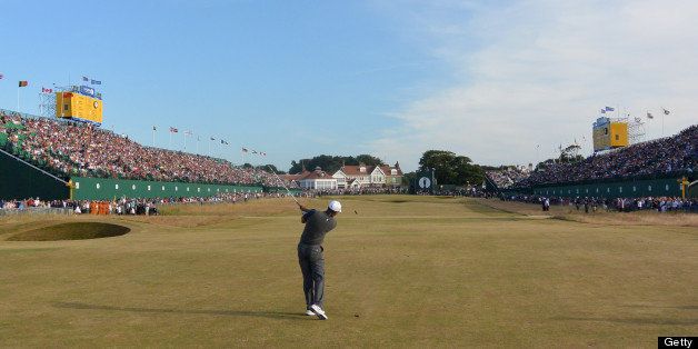 GULLANE, SCOTLAND - JULY 20: Tiger Woods of the United States plays his second shot on the 18th hole during the third round of the 142nd Open Championship at Muirfield on July 20, 2013 in Gullane, Scotland. (Photo by David Cannon/R&A/R&A via Getty Images)