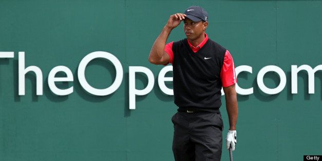 US golfer Tiger Woods prepares to tee off on the first during the fourth and final round of the 2013 British Open Golf Championship at Muirfield golf course at Gullane in Scotland on July 21, 2013 . AFP PHOTO/PETER MUHLY (Photo credit should read PETER MUHLY/AFP/Getty Images)