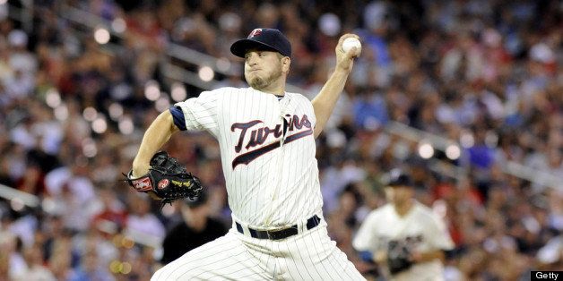 MINNEAPOLIS, MN - JULY 20: Relief pitcher Glen Perkins #15 of the Minnesota Twins delivers a pitch in the ninth inning against the Cleveland Indians of the game at Target Field on July 20, 2013 in Minneapolis, Minnesota. The Twins defeated the Indians 3-2. (Photo by Marilyn Indahl/Getty Images)