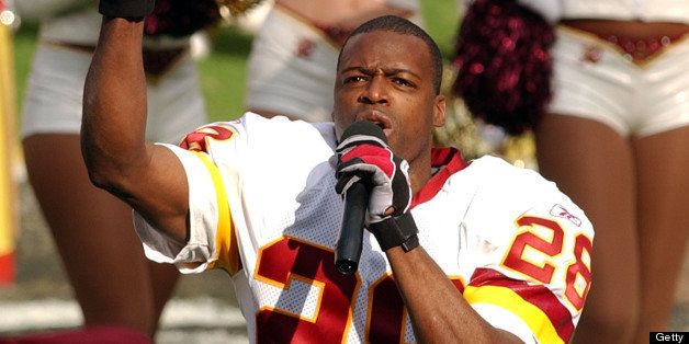 LANDOVER, UNITED STATES: Washington Redskins cornerback, Darrell Green, delivers a farewell speech to the fans in his final game of his 20-year NFL career before the Redskins vs. Dallas Cowboys game 29 December 2002 at FedEx Field in Landover, MD. AFP PHOTO/HEATHER HALL (Photo credit should read HEATHER HALL/AFP/Getty Images)
