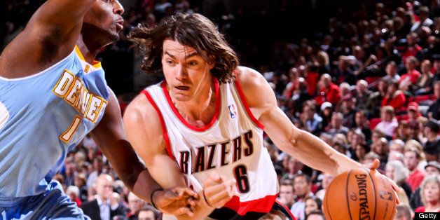 PORTLAND, OR - OCTOBER 17: Adam Morrison #6 of the Portland Trail Blazers drives against Jordan Hamilton #1 of the Denver Nuggets during a pre-season game on October 17, 2012 at the Rose Garden Arena in Portland, Oregon. NOTE TO USER: User expressly acknowledges and agrees that, by downloading and or using this photograph, user is consenting to the terms and conditions of the Getty Images License Agreement. Mandatory Copyright Notice: Copyright 2012 NBAE (Photo by Sam Forencich/NBAE via Getty Images)
