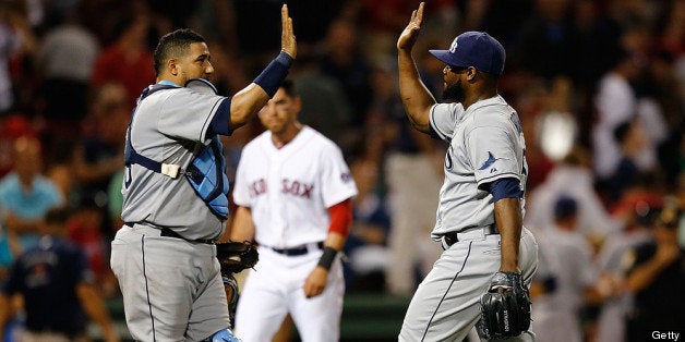 BOSTON, MA - JULY 29: Fernando Rodney #56 and Jose Molina #28 of the Tampa Bay Rays celebrate a 2-1 win as Jacoby Ellsbury #2