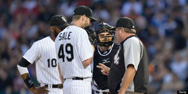CHICAGO, IL- JULY 22: Pitching coach Don Cooper #99 of the Chicago White Sox (R) talks with shortstop Alexei Ramirez #10, starting pitcher Chris Sale #49 and catcher Josh Phegley #36 during action against the Detroit Tigers at U. S. Cellular Field on July 22, 2013 in Chicago, Illinois. The Tigers defeated the White Sox 7-3. (Photo by Brian D. Kersey/Getty Images)