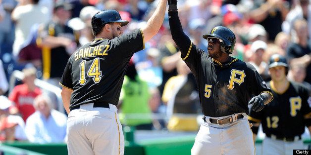 WASHINGTON, DC - JULY 25: Josh Harrison #5 of the Pittsburgh Pirates celebrates with Gaby Sanchez #14 after hitting a home run in the sixth inning against the Washington Nationals at Nationals Park on July 25, 2013 in Washington, DC. (Photo by Greg Fiume/Getty Images)