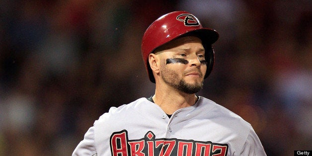 BOSTON, MA - AUGUST 2: Cody Ross #7 of the Arizona Diamondbacks runs down the first base line after grounding out to the shor