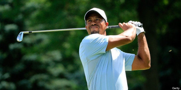 AKRON, OH - AUGUST 03: Tiger Woods hits off the sixth tee during the Third Round of the World Golf Championships-Bridgestone Invitational at Firestone Country Club South Course on August 3, 2013 in Akron, Ohio. (Photo by Sam Greenwood/Getty Images)