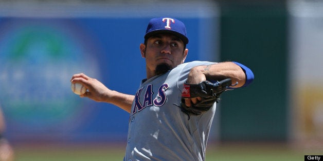 OAKLAND, CA - AUGUST 3: Matt Garza #22 of the Texas Rangers pitches against the Oakland Athletics during the game at O.co Co
