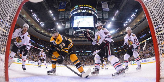 BOSTON, MA - JUNE 19 : Chris Kelly #23 of the Boston Bruins watches the loose puck against the Chicago Blackhawks in Game Four of the Stanley Cup Final at TD Garden on June 19, 2013 in Boston, Massachusetts. (Photo by Brian Babineau/NHLI via Getty Images)