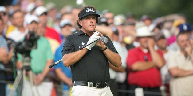 ROCHESTER, NY - AUGUST 8: Phil Mickelson of the United States watches his tee shot on 13 during the first round of play at the 95th PGA Championship, at the Oak Hill Country Club, on August 8, 2013 in Rochester, NY. (Photo by Darren Carroll/The PGA of America via Getty Images)