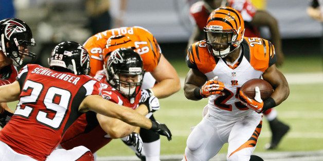 ATLANTA, GA - AUGUST 08: Giovani Bernard #25 of the Cincinnati Bengals rushes away from Shann Schillinger #29 of the Atlanta Falcons at Georgia Dome on August 8, 2013 in Atlanta, Georgia. (Photo by Kevin C. Cox/Getty Images)