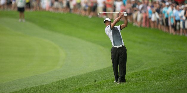 ROCHESTER, NY - AUGUST 10: Tiger Woods of the United States hits his 2nd shot on 2 during the third round of play at the 95th PGA Championship at Oak Hill Country Club on August 10, 2013 in Rochester, New York. (Photo by Darren Carroll/The PGA of America via Getty Images) 