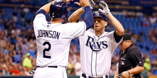 ST. PETERSBURG - AUGUST 13: Outfielder Kelly Johnson #2 of the Tampa Bay Rays congratulates Ben Zobrist #18 after his fifth inning home run against the Seattle Mariners during the game at Tropicana Field on August 13, 2013 in St. Petersburg, Florida. (Photo by J. Meric/Getty Images)