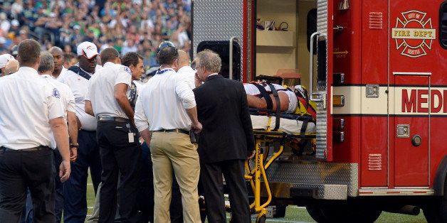 SEATTLE, WA. - AUGUST 17: Denver Broncos defensive end Derek Wolfe (95) is loaded on the ambulance after suffering an injury in the first quarter against the Seattle Seahawks August 17, 2013 at Century Link Field. (Photo By John Leyba/The Denver Post via Getty Images)