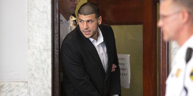 ATTLEBORO, MA - JULY 24: Aaron Hernandez entered the court room. Former New England Patriots tight end Aaron Hernandez appeared in Attleboro District Court in Attleboro, Mass. on Wednesday, July 24, 2013. (Photo by Yoon S. Byun/The Boston Globe via Getty Images)