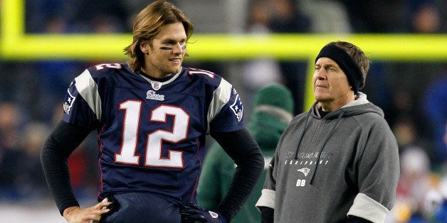 FOXBORO, MA - DECEMBER 19: Quarterback Tom Brady #12 of the New England Patriots talks with head coach Bill Belichick before playing against the Green Bay Packers at Gillette Stadium on December 19, 2010 in Foxboro, Massachusetts. The Patriots won the game 31-27. (Photo by Jim Rogash/Getty Images)