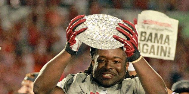Alabama running back Eddie Lacy, the game's MVP, celebrates with the championship trophy following a 42-14 win against Notre Dame in the BCS National Championship game at Sun Life Stadium on Monday, January 7, 2013, in Miami Gardens, Florida. (Charles Trainor Jr./Miami Herald/MCT via Getty Images)
