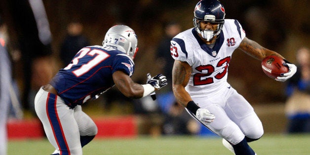 FOXBORO, MA - JANUARY 13: Arian Foster #23 of the Houston Texans runs with the ball against Alfonzo Dennard #37 of the New E