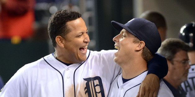 DETROIT, MI - SEPTEMBER 24: Miguel Cabrera #24 and Andy Dirks #12 of the Detroit Tigers share a laugh together in the dugout during the game against the Baltimore Orioles at Comerica Park on September 24, 2011 in Detroit, Michigan. The Orioles defeated the Tigers 6-5. (Photo by Mark Cunningham/MLB Photos via Getty Images)
