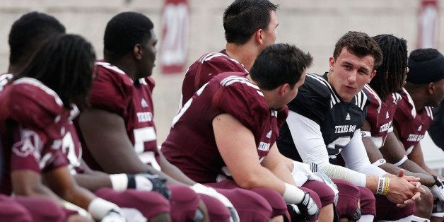 COLLEGE STATION, TX - APRIL 13: Texas A&M Aggies quarterback Johnny Manziel #2 (black jersey) waits with his teammates on the bench during the Maroon & White spring football game at Kyle Field on April 13, 2013 in College Station, Texas. (Photo by Scott Halleran/Getty Images)